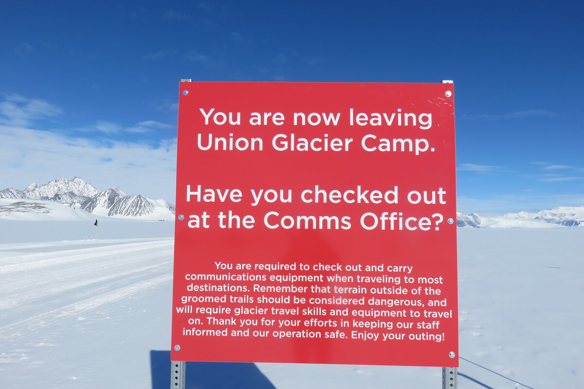 Exit sign reminds guests to sign-out when leaving camp